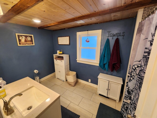 bathroom featuring wood ceiling, sink, beam ceiling, and tile patterned flooring