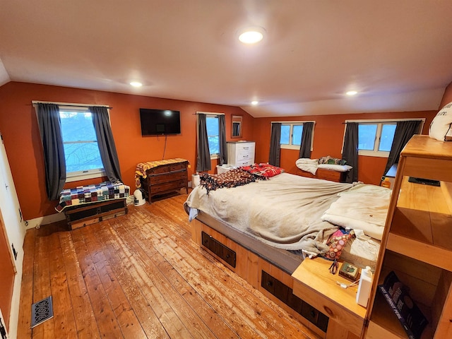 bedroom featuring vaulted ceiling and hardwood / wood-style floors