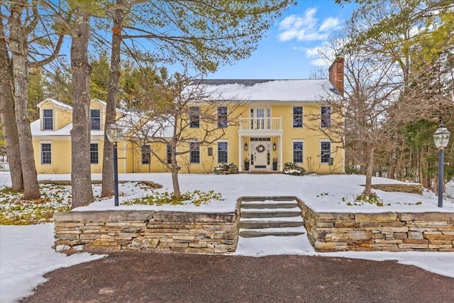 colonial home with a balcony