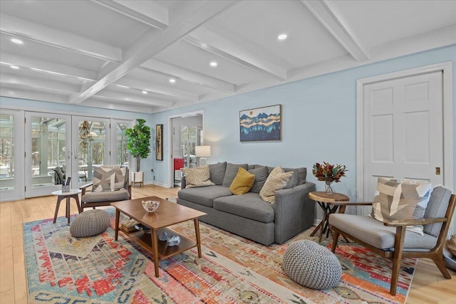 living room featuring light hardwood / wood-style flooring, french doors, and beamed ceiling