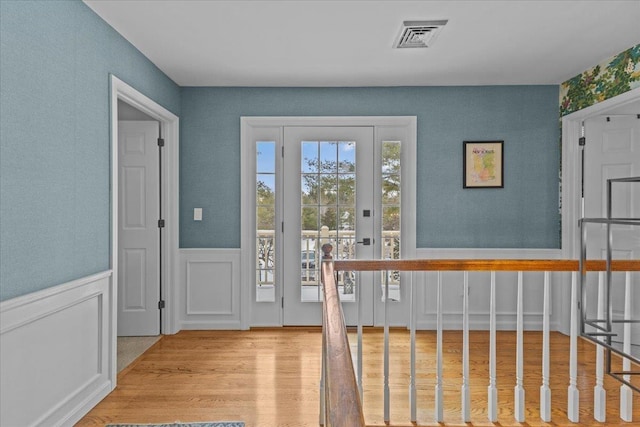 doorway to outside with light hardwood / wood-style floors