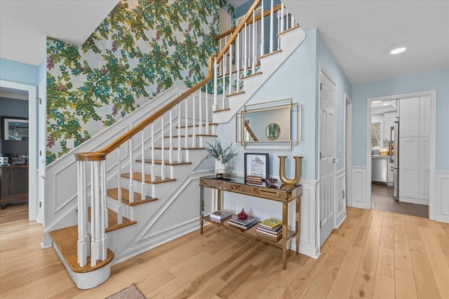 staircase featuring hardwood / wood-style floors