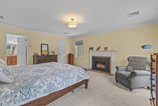 carpeted bedroom with connected bathroom, a fireplace, and ornamental molding