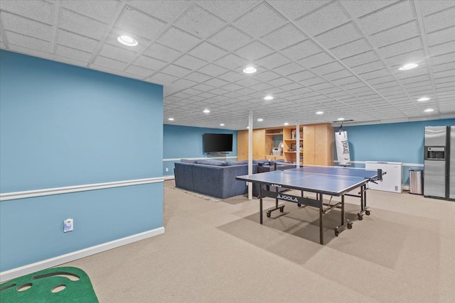 recreation room with light carpet