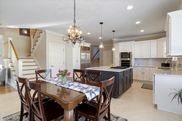 tiled dining room with an inviting chandelier, sink, and ornamental molding