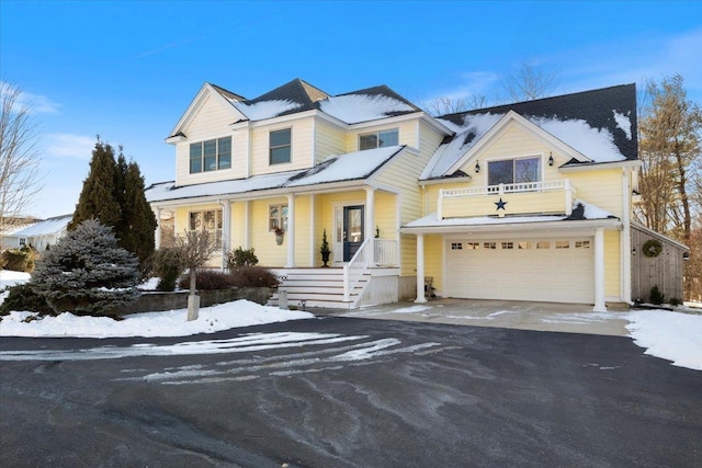 view of front of home featuring a balcony and a garage