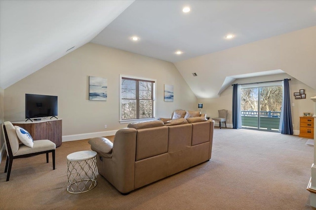 living room with lofted ceiling and light carpet