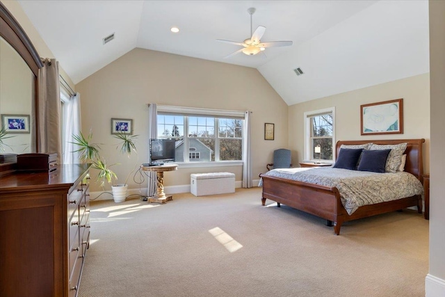 carpeted bedroom featuring multiple windows, vaulted ceiling, and ceiling fan