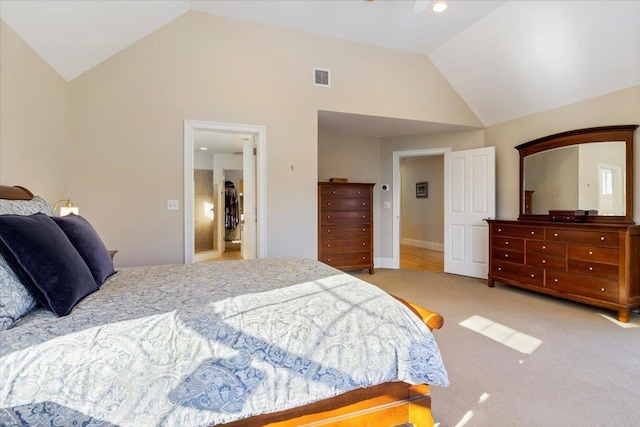 carpeted bedroom with lofted ceiling