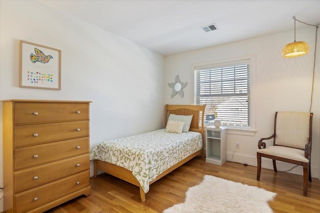 bedroom with light hardwood / wood-style flooring