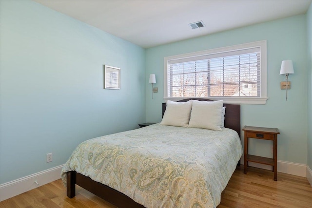 bedroom with light wood-type flooring