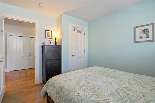 bedroom featuring a closet and light hardwood / wood-style flooring