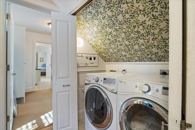 laundry area with independent washer and dryer and light carpet