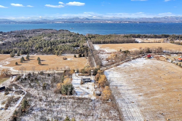 aerial view featuring a water and mountain view