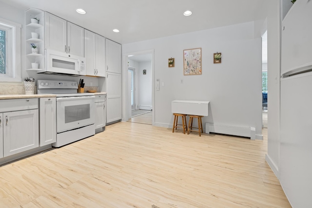 kitchen with white cabinetry, light hardwood / wood-style flooring, white appliances, and a baseboard radiator