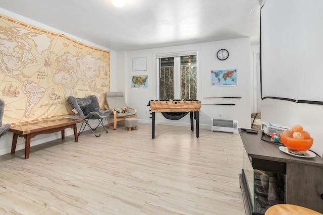 sitting room featuring light hardwood / wood-style flooring