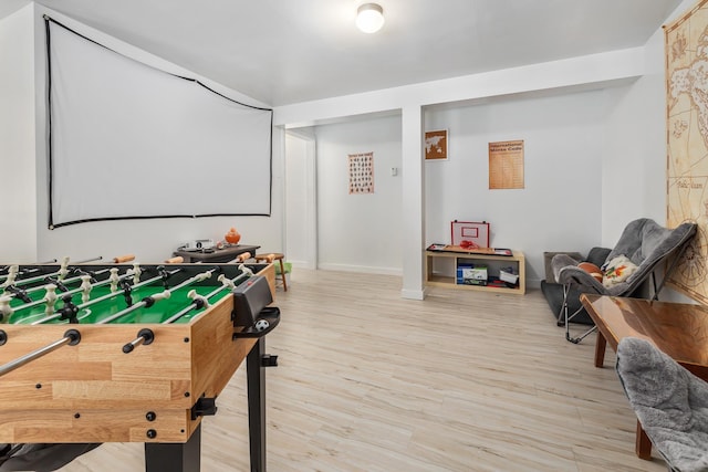 recreation room with hardwood / wood-style floors