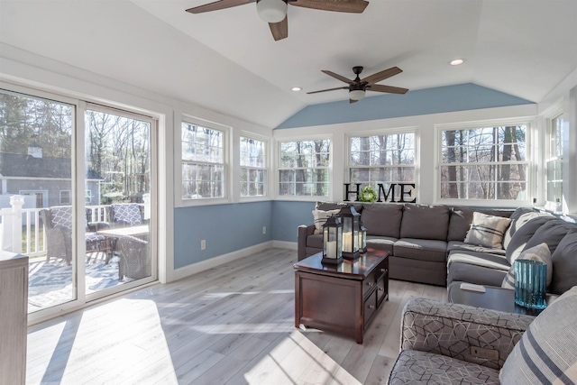 sunroom with lofted ceiling and a wealth of natural light