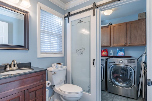 bathroom with toilet, ornamental molding, vanity, independent washer and dryer, and tile patterned flooring