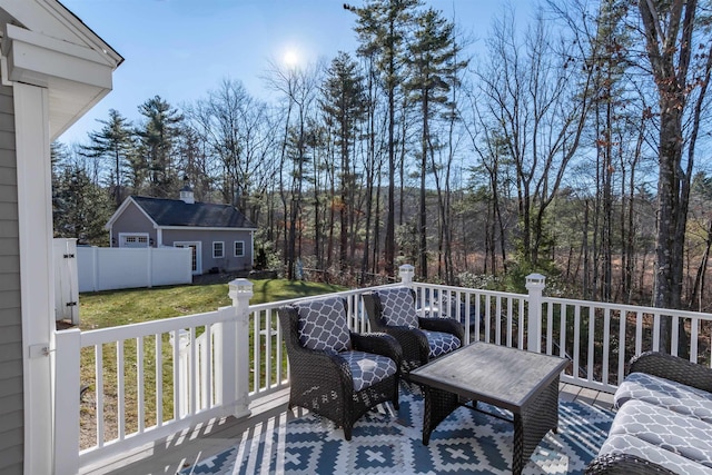 wooden terrace featuring a yard