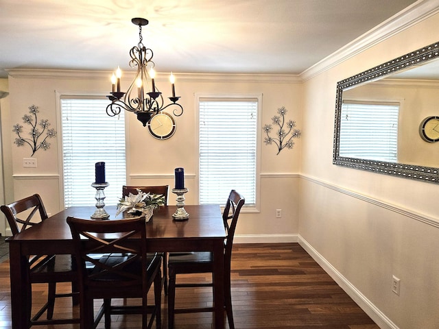 dining space featuring ornamental molding, an inviting chandelier, and dark hardwood / wood-style flooring