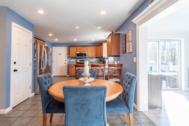 dining area featuring light tile patterned floors