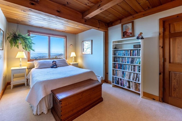 bedroom with light carpet, a baseboard heating unit, wood ceiling, and beam ceiling