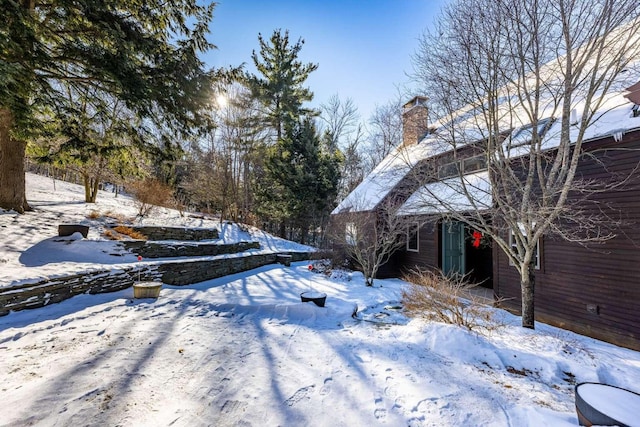 view of yard layered in snow