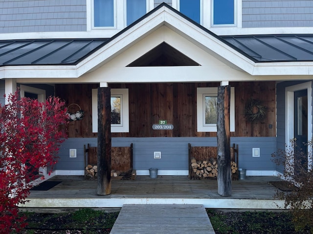 view of exterior entry featuring a porch