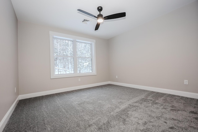 carpeted empty room featuring ceiling fan