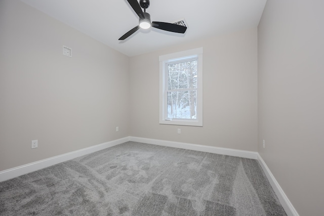 empty room featuring ceiling fan and carpet flooring