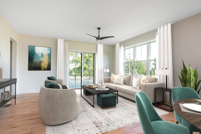 living room with ceiling fan and light hardwood / wood-style floors