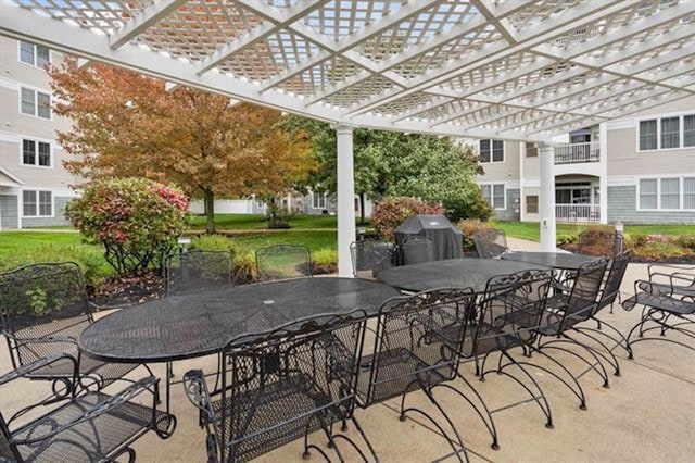 view of patio / terrace featuring area for grilling and a pergola