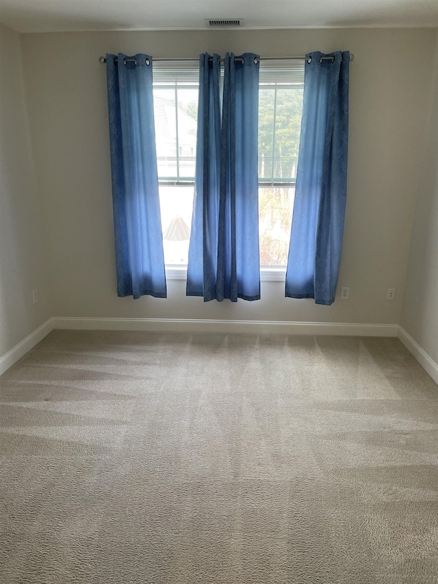 empty room featuring carpet flooring