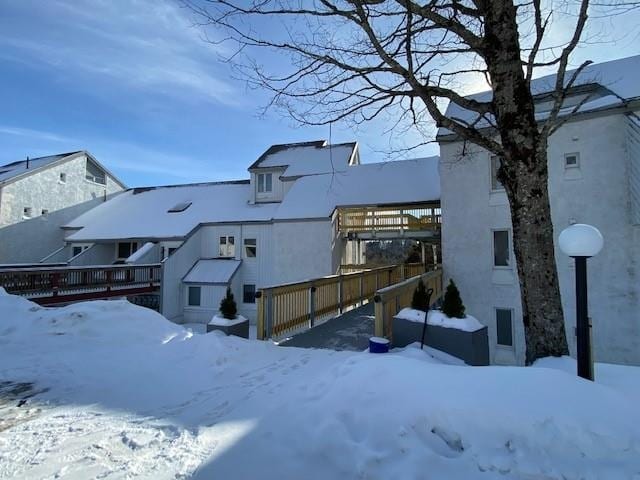 view of snow covered house