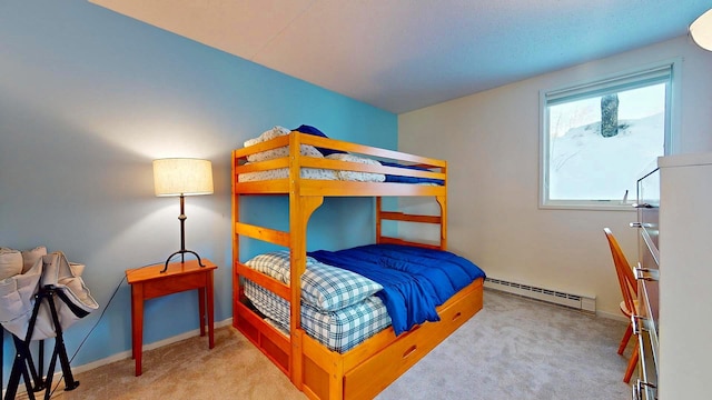 bedroom featuring light carpet and baseboard heating