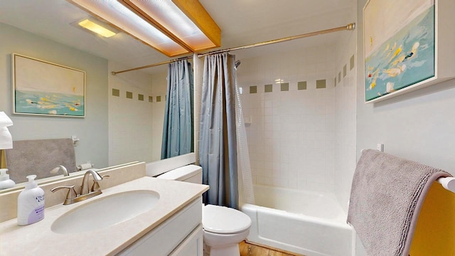 full bathroom with vanity, toilet, and shower / bath combo with shower curtain