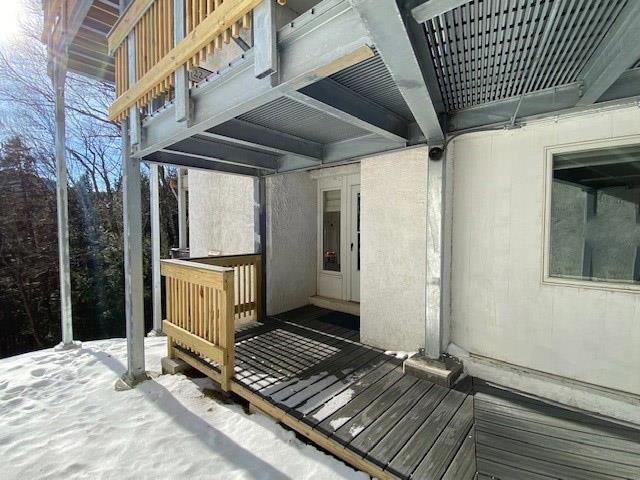 view of snow covered deck