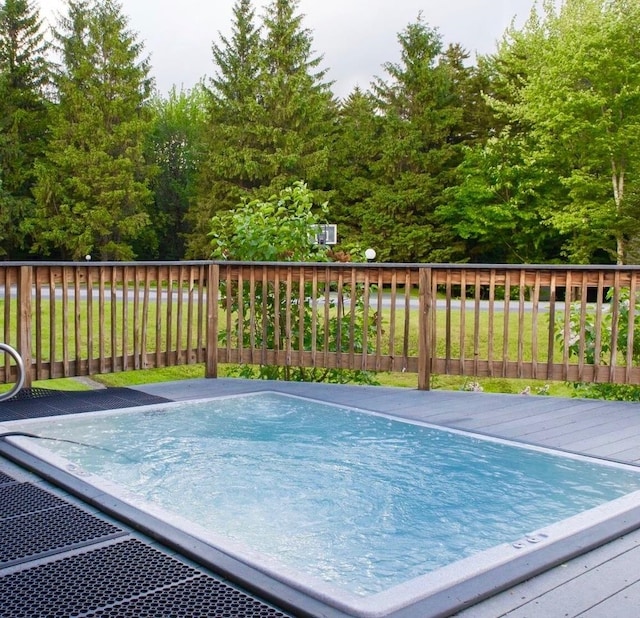 view of swimming pool with a wooden deck