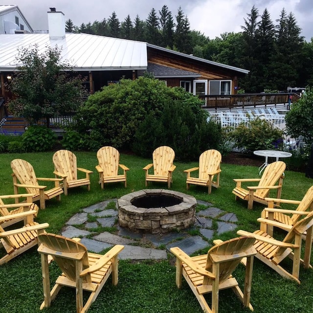 view of yard featuring a patio and a fire pit