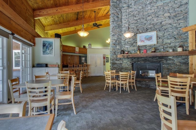 carpeted dining room featuring high vaulted ceiling, wooden ceiling, and beam ceiling