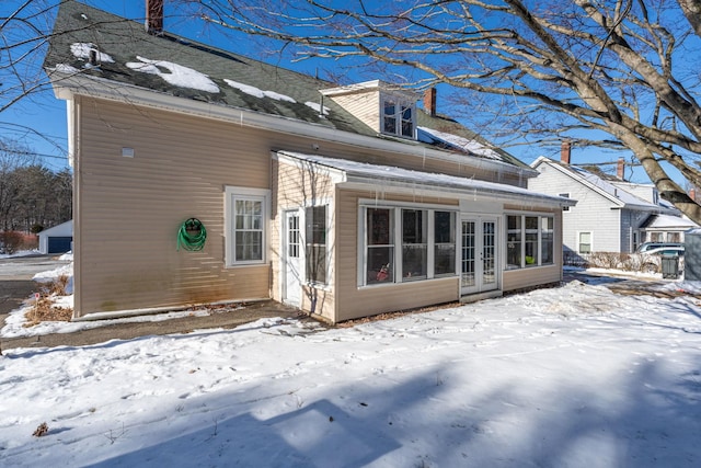 view of snow covered house