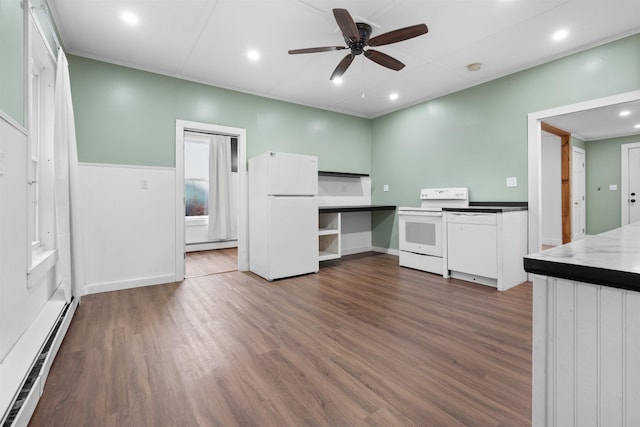 kitchen with a baseboard radiator, dark hardwood / wood-style floors, white cabinets, and white appliances