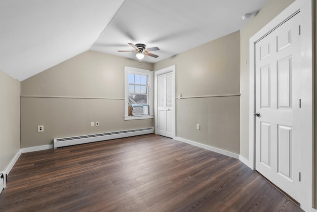 additional living space featuring ceiling fan, baseboard heating, cooling unit, dark hardwood / wood-style flooring, and vaulted ceiling