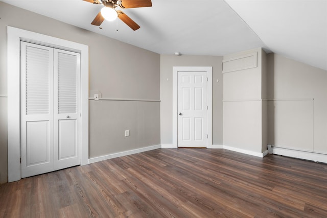 unfurnished bedroom featuring a baseboard radiator, ceiling fan, and dark hardwood / wood-style flooring