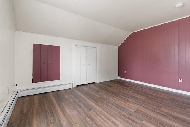 bonus room featuring vaulted ceiling, dark hardwood / wood-style floors, and baseboard heating