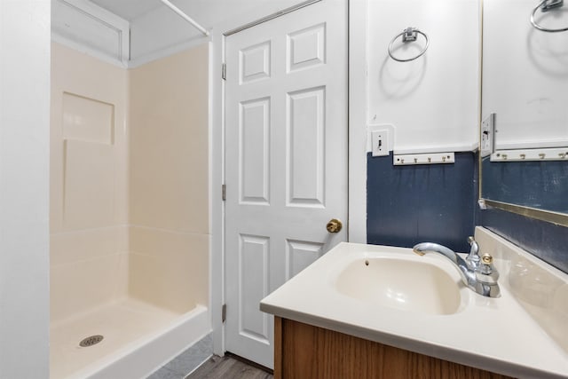 bathroom with vanity and walk in shower