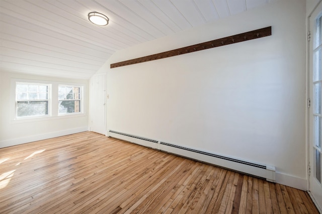 spare room with baseboard heating, wood ceiling, lofted ceiling, and light hardwood / wood-style floors