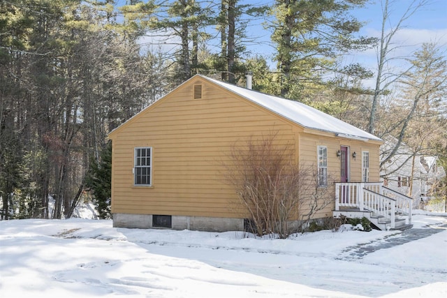 view of snow covered property