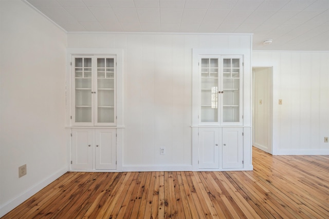 unfurnished room featuring light hardwood / wood-style flooring